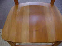 Natural Cherry chairs with deep pressure dents and scratches.
