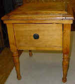 A childs antique commode after repairs.