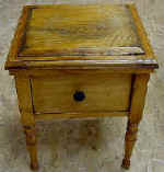 A childs antique commode after repairs over-view.