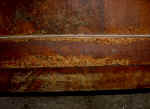 An antique sideboard door closeup before repairs.