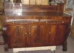 An antique sideboard overview after repairs.