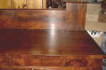 An antique sideboard top closeup after repairs.